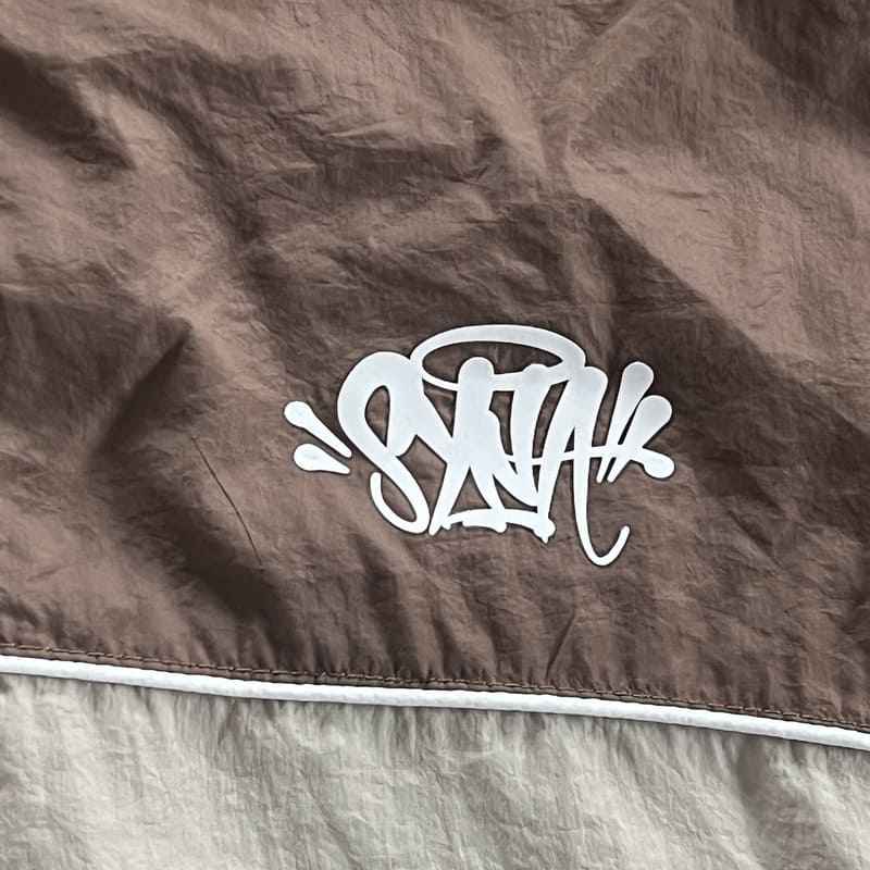 Conjunto Synaworld 'Syna Logo' Shell Café/Beige