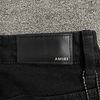 Pantalón Amiri Jeans Staggered Logo Preta