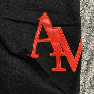 Pantalón Amiri Jeans Staggered Logo Preta
