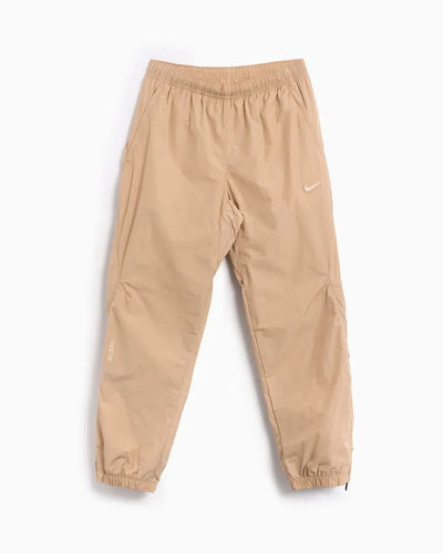 Conjunto Nike x NOCTA Woven Track Beige Areia/Café Claro