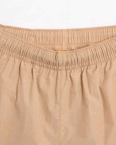 Conjunto Nike x NOCTA Woven Track Beige Areia/Café Claro