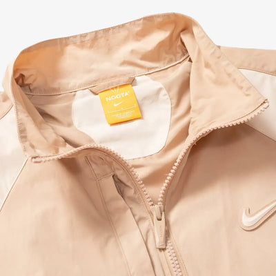 Conjunto Nike x NOCTA Woven Track Beige Areia/Café Claro